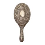 A Victorian silver hand mirror, the bevelled plate in crimped surround, by Charles Edwards, London