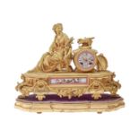 A French giltmetal mantel clock, late 19th c, in Louis XVI style, inset with pink ground Sevres