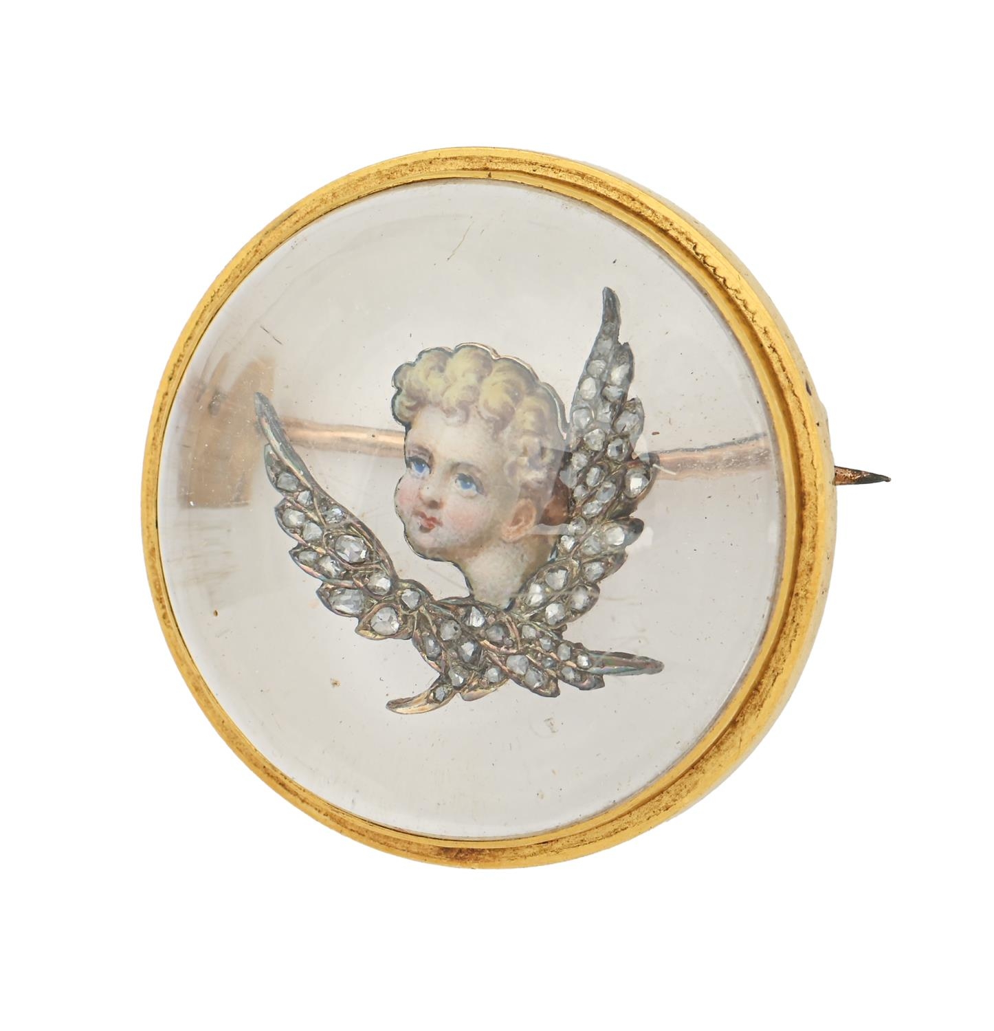 A Victorian diamond, reverse painted  crystal intaglio and gold brooch, painted with the head of a