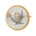 A Victorian diamond, reverse painted  crystal intaglio and gold brooch, painted with the head of a