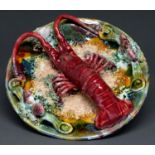 A Continental Palissy Ware majolica lobster dish, 20th c, 26cm diam Good condition