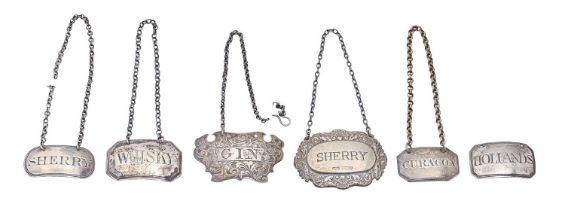 Five silver decanter labels, George III - Victorian, cartouche shaped example 55mm l, London and