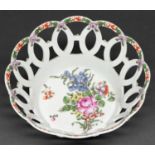 A Worcester openwork basket, c1770, painted to the centre with a loose bouquet, including a