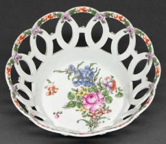 A Worcester openwork basket, c1770, painted to the centre with a loose bouquet, including a