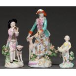 Three Derby figures of a Shepherd playing a reed-pipe, a huntsman’s lady and a girl with a basket,