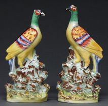 A pair of Staffordshire flatback models of brightly plumaged birds, c1860, 31cm h Enamels flaking in