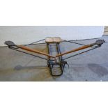 A vintage rowing machine, early 20th c, the frame 94cm l Typical wear and pockets of rust. Stable