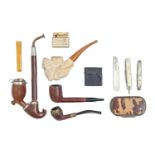 Smoking. A meerschaum tobacco pipe, the bowl carved with the naked figure of a woman, a briarwood