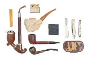 Smoking. A meerschaum tobacco pipe, the bowl carved with the naked figure of a woman, a briarwood