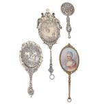 Three Continental decorative miniature silver hand mirrors and another of giltmetal, all c1900,