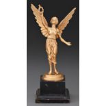 Gold. A 9ct gold statuette of Nike, on stepped base, 25.8cm h including ebonised plinth, by James
