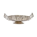 A Victorian wrythen fluted silver sweetmeat dish, with cast openwork demi-figure handles, on foot,