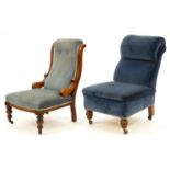 A Victorian mahogany scroll back nursing chair and another, on carved oak feet, later shepherd