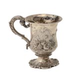 A Victorian silver christening mug, of campana shape, chased with reserves of fruit, on spool