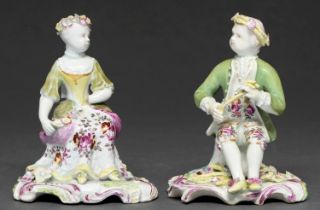 A pair of Longton Hall figures of a seated boy and girl, 'Spring' and 'Summer', c1758-1760, in