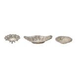One Edwardian and two Victorian die stamped and pierced silver sweetmeat dishes, 16cm and smaller,