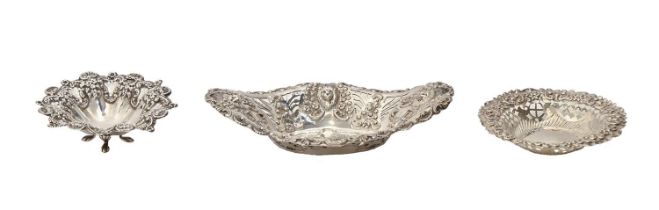 One Edwardian and two Victorian die stamped and pierced silver sweetmeat dishes, 16cm and smaller,