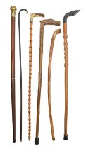 A bamboo cane with antler handle and five various other walking sticks and canes, early 20th c and