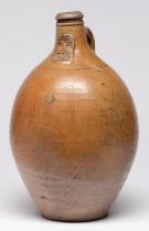 A German saltglazed brown stoneware Bartmann bottle,  c1700, applied with bearded mask and impressed