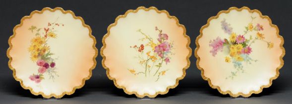 A set of three Royal Worcester dessert plates, 1897, printed and painted with wildflowers on a