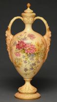 A Royal Worcester vase and cover, 1909, with mask handles and printed and painted with flowers on