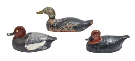 Three carved and painted wood duck decoys, two possibly Brittany, late 19th c or later, with glass