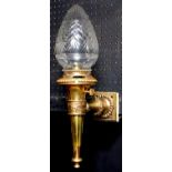 A Victorian brass gas wall light and cut glass shades of torch form, c1900, beaded rims, 44cm h,