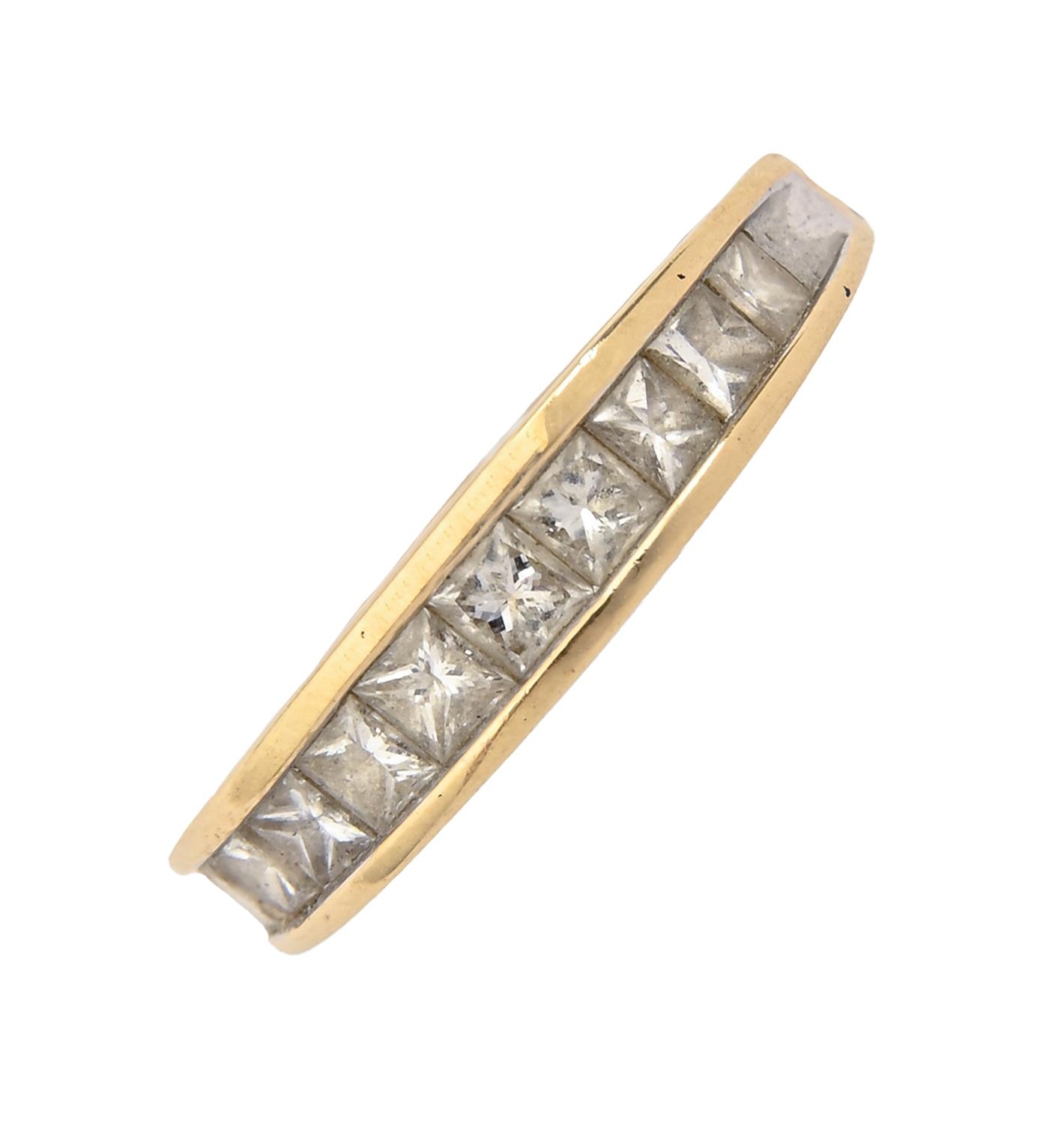 A diamond ring, with row of princess cut diamonds, in 18ct gold, 4.2g, size P Light wear