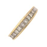 A diamond ring, with row of princess cut diamonds, in 18ct gold, 4.2g, size P Light wear