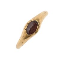 A medieval gold ring, c1200-1450, set with a garnet, 2.8g, size J, PAS record ID: ESS-6B7646   Found