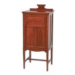 An Edwardian mahogany music cabinet, crossbanded in satinwood and line inlaid, with panelled door,
