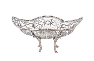 An Edwardian pierced silver sweetmeat dish, on four incurved legs, 17cm l, by James Dixon & Sons