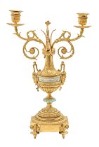 A French gilt brass and porcelain candelabra, c1900, in neo classical style with two scrolling