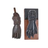 A Victorian cast iron lady's hand door knocker and stud, 14cm, maker's mark, an anchor flanked by CF