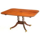 A George IV mahogany breakfast table, the oblong top on profile uprights, platform and swept legs