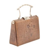 A Victorian EPNS mounted tooled leather handbag shaped sewing necessaire, c1900, each side opening