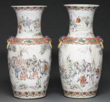 A pair of Chinese famille rose vases, 19th c, with mask handles, painted in two registers with