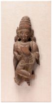 An Indian wood sculpture of an aspara or female deity, 18th / 19th c, traces of polychrome, 30cm