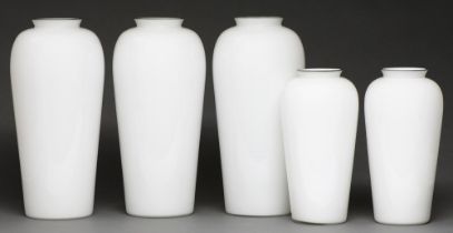 A set of five white cased glass vases, with silver coloured metal rim, 42cm h
