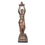 A French fin de siecle spelter figural lamp, c1900, in the form of a young woman on square base,