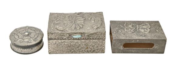 Two Arts and Crafts pewter covered wood boxes and a similar matchbox slide, early 20th c, embossed