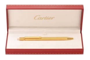A Cartier gold plated ballpoint pen, boxed