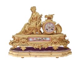 A French giltmetal mantel clock, late 19th c, in Louis XVI style, inset with pink ground Sevres