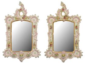 A pair of German porcelain floral encrusted mirrors, late 20th c, 80 x 51cm Overall very good
