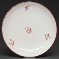 A Pinxton saucer-dish, pattern 1, c1800, enamelled with sprigs, 20.5cm diam Slightly worn