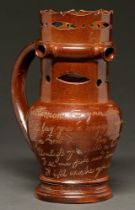 A documentary Derbyshire saltglazed brown stoneware puzzle jug, Richard Evans' Ilkeston Pottery,