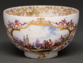 A Meissen Kauffahrtei tea bowl, c. 1740, painted in the manner of Herold with two harbour scenes,