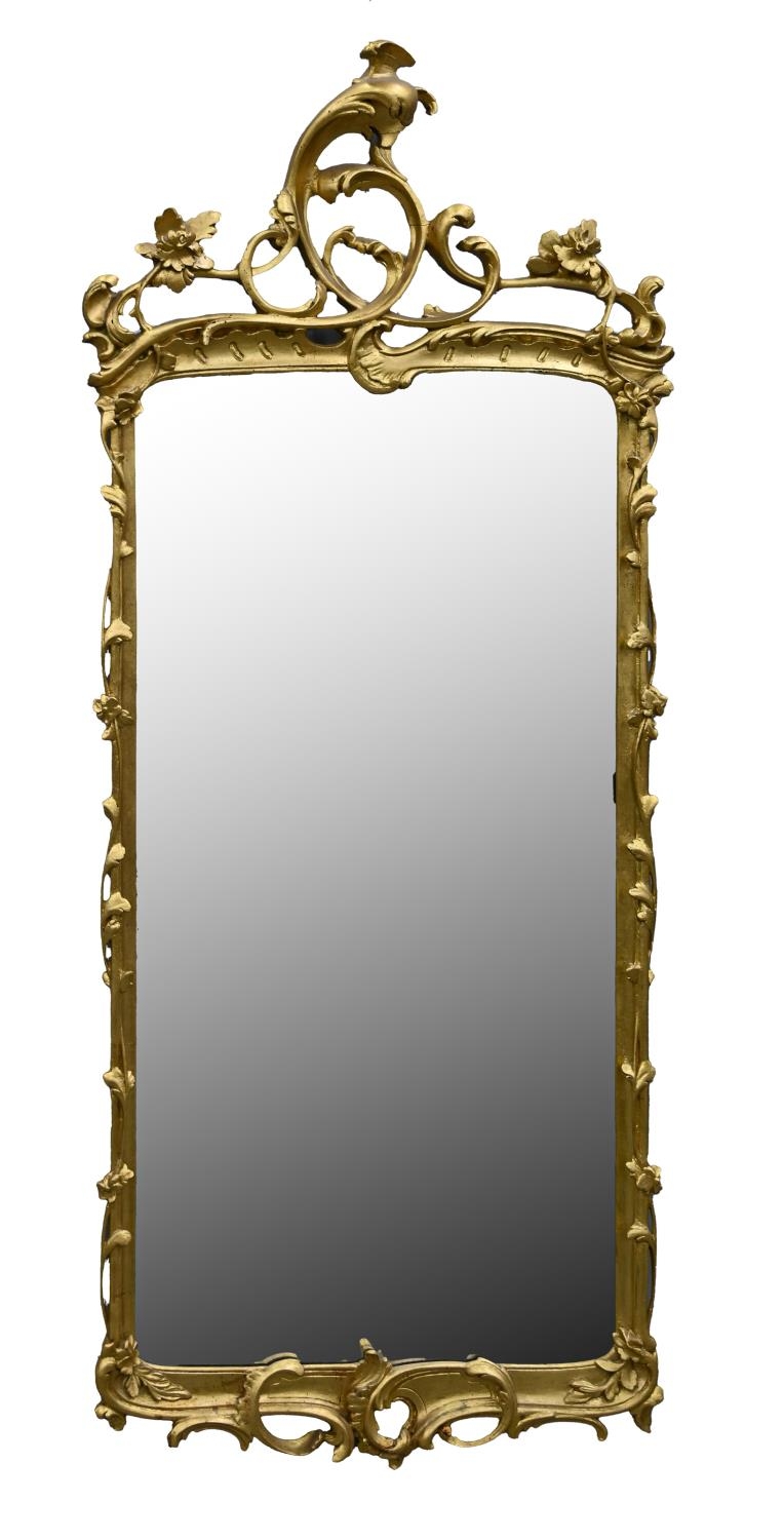 A giltwood mirror, early 20th c, in rococo style, 155 x 65cm Undamaged, gilding dusty / dirty, glass