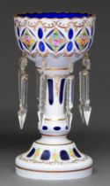 A Bohemian overlay blue glass lustre vase, with cut glass pendants, 26cm h