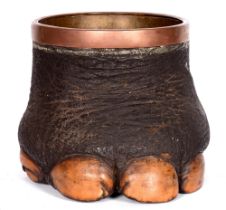 Taxidermy. A late 19th c elephant's foot jardiniere, with copper liner, 32cm h, 34cm diam